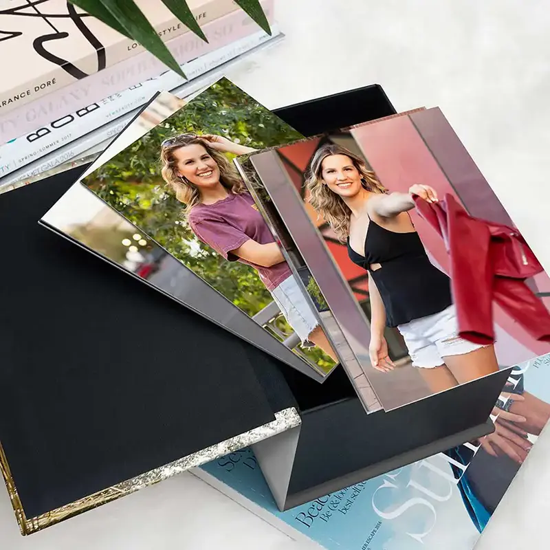 Elegant black image box filled with mounted senior photos from a portrait session in Arizona.
