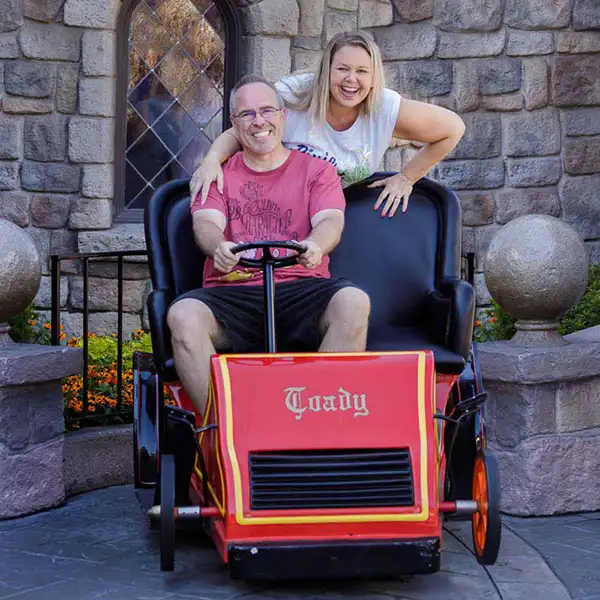 Michelle and her husband laughing together on Mr. Toad’s Wild Ride at Disneyland.