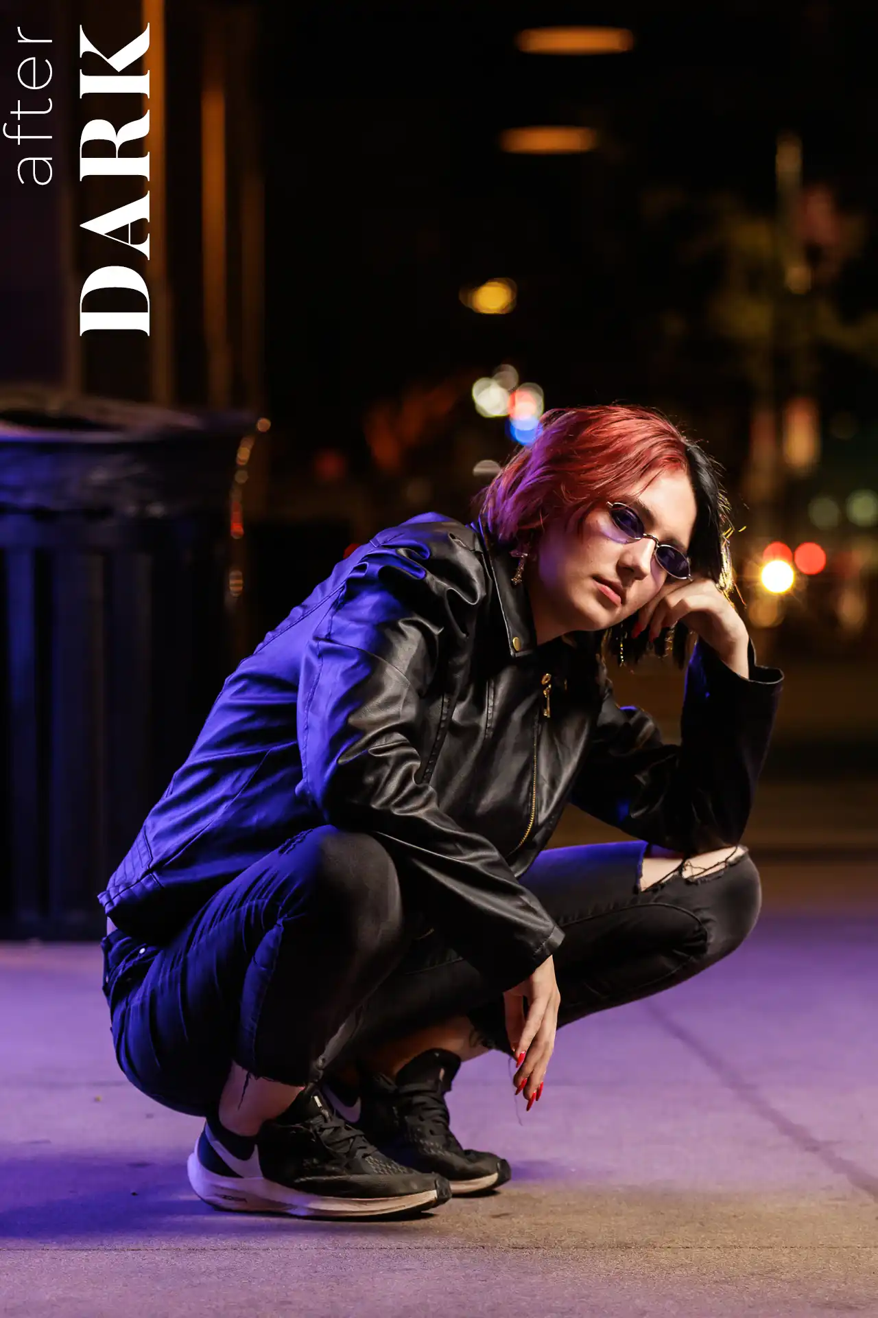 Senior girl wearing a leather jacket and sunglasses during her nighttime senior session in Chandler, Arizona.