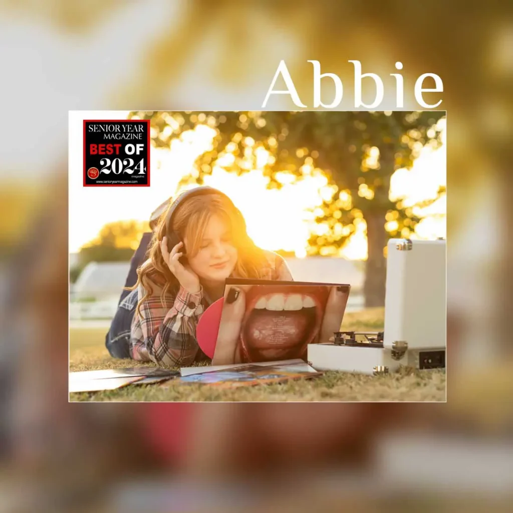 Creative senior photo of a girl with a record player and vinyl at sunset, taken by one of Mesa’s best senior portrait photographers.