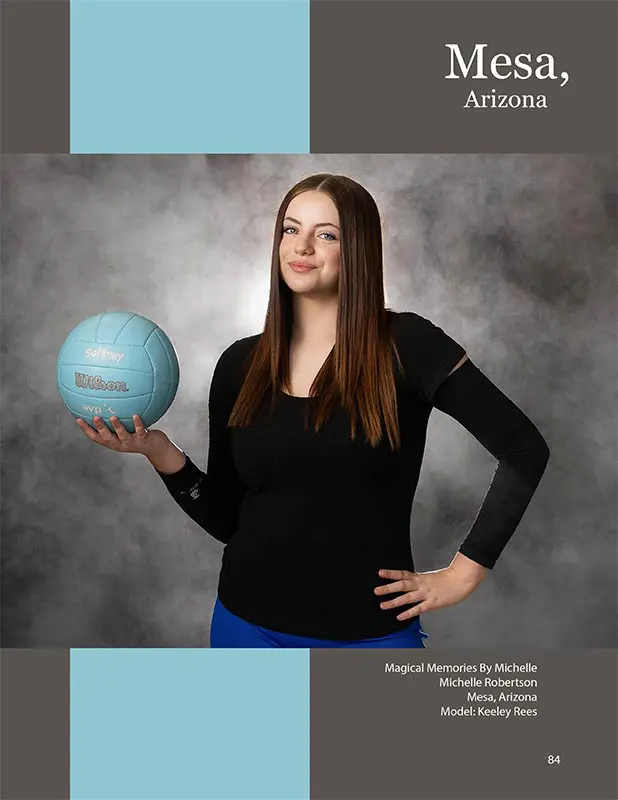 Confident teen girl in black and blue volleyball outfit posing with a turquoise volleyball in Mesa, Arizona.
