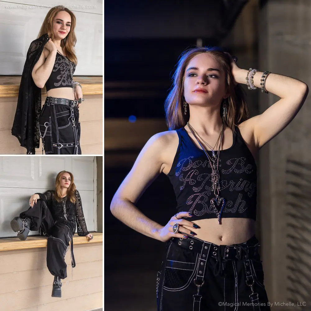 Senior girl rocking a bold all-black outfit with chains and layered jewelry in an urban photo shoot.
