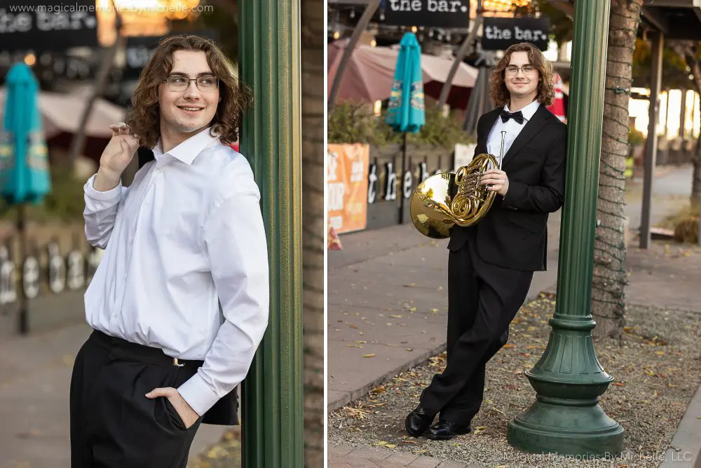 Senior boy in a black tuxedo holding a French horn during formal band senior pictures in Phoenix, Arizona.